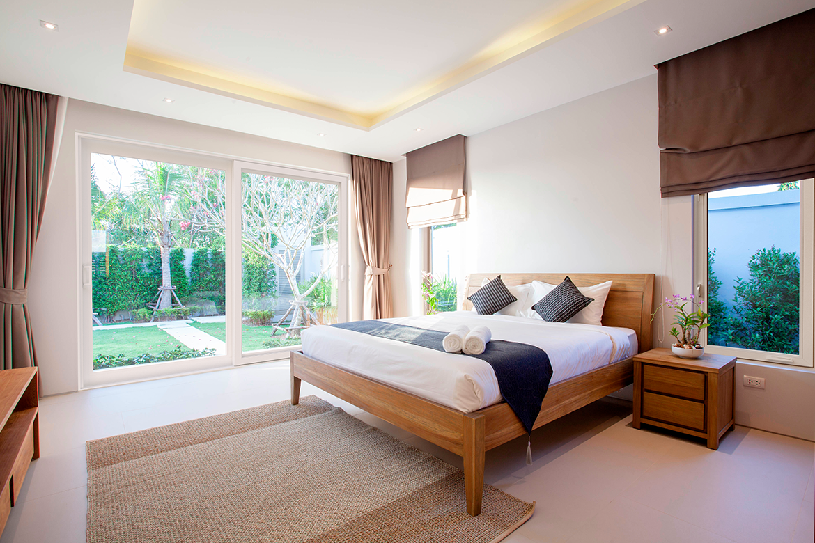 Bedroom with energy efficient, impact resistant hurricane windows